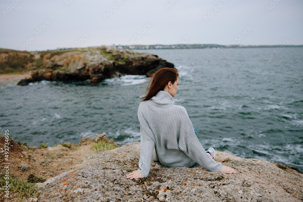 beautiful woman sweaters cloudy sea admiring nature Lifestyle beautiful woman sweaters cloudy sea admiring nature Lifestyle