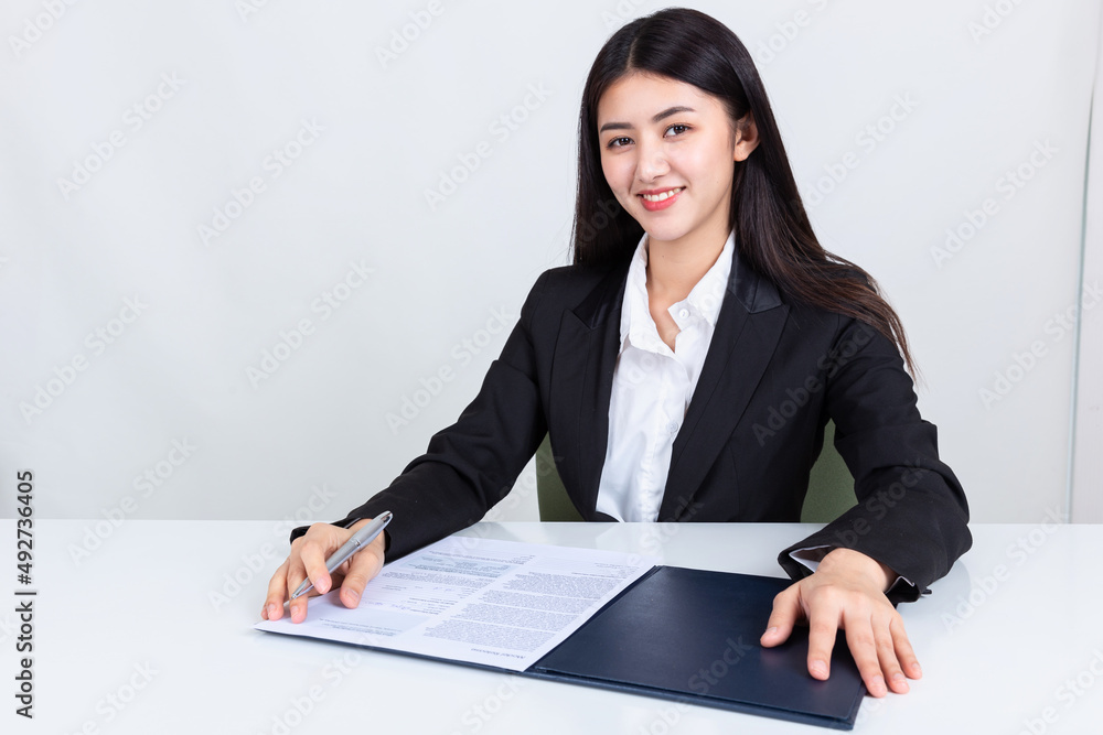 asian business woman working in office with documents. asian business woman working in office with documents.