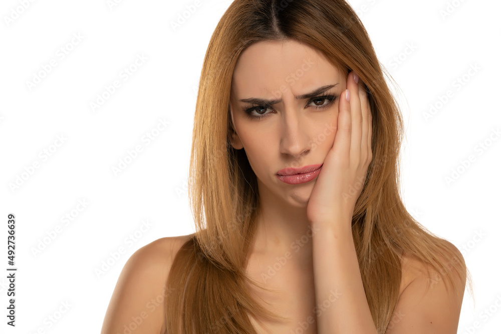 Portrait of a young blond woman with a toothache Portrait of a young blond woman with a toothache