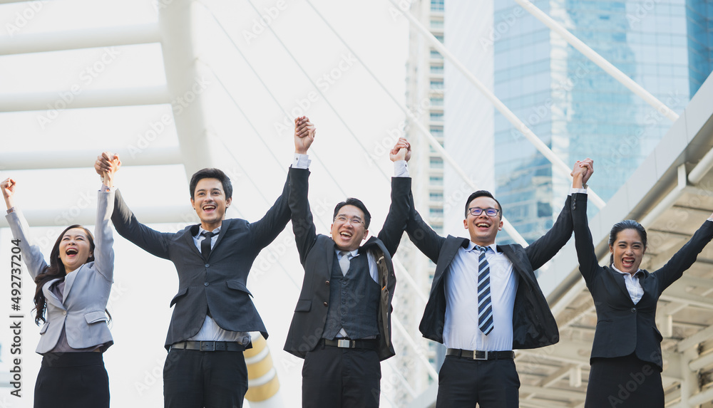 victory business team showing hands up, Successful business people working together joyful victory. victory business team showing hands up, Successful business people working together joyful victory.
