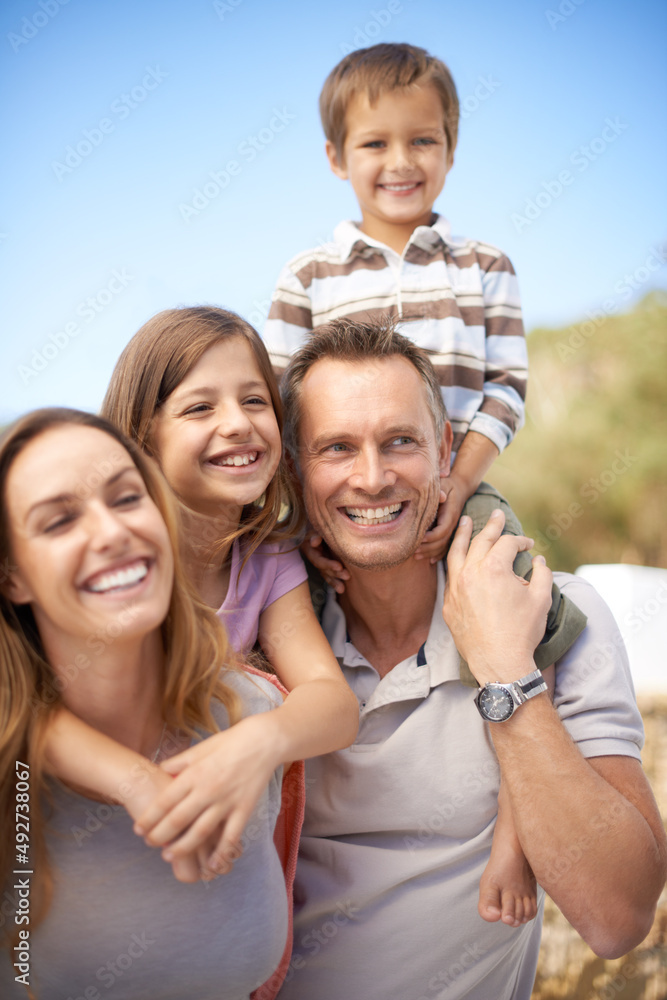 One awesome family adventure. Portrait of a happy family of four having fun while on holiday. One awesome family adventure. Portrait of a happy family of four having fun while on holiday.