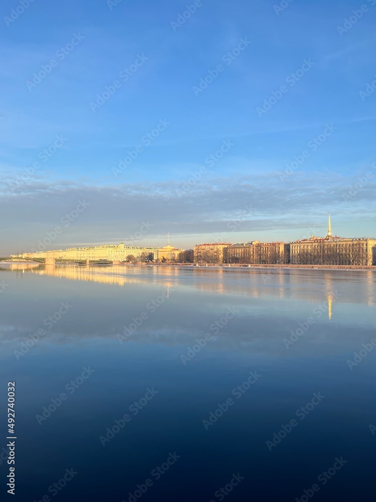 River surface with the reflection of the historical city architecture, blue sky, peaceful River surface with the reflection of the historical city architecture, blue sky, peaceful