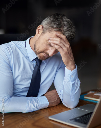 The pursuit of success comes with its fair share of stress. Cropped shot of a mature businessman looking anxious while working in his office.