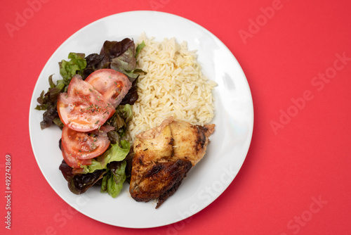 grilled chicken with boiled rice and fresh salad