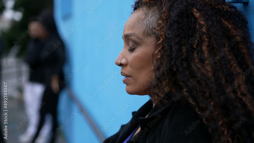 An Anxious African woman having difficult times feeling stressed out An Anxious African woman having difficult times feeling stressed out