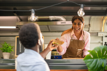 Black man buying fast food in truck