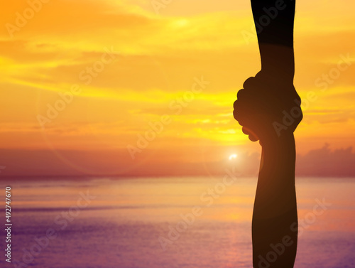 handshake help and hope and international peace day concept silhouette