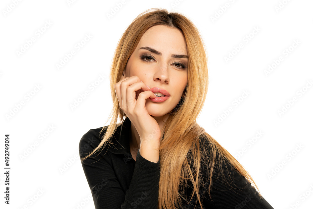 Sensual portrait of a young woman with long straight hair and black blouse Sensual portrait of a young woman with long straight hair and black blouse