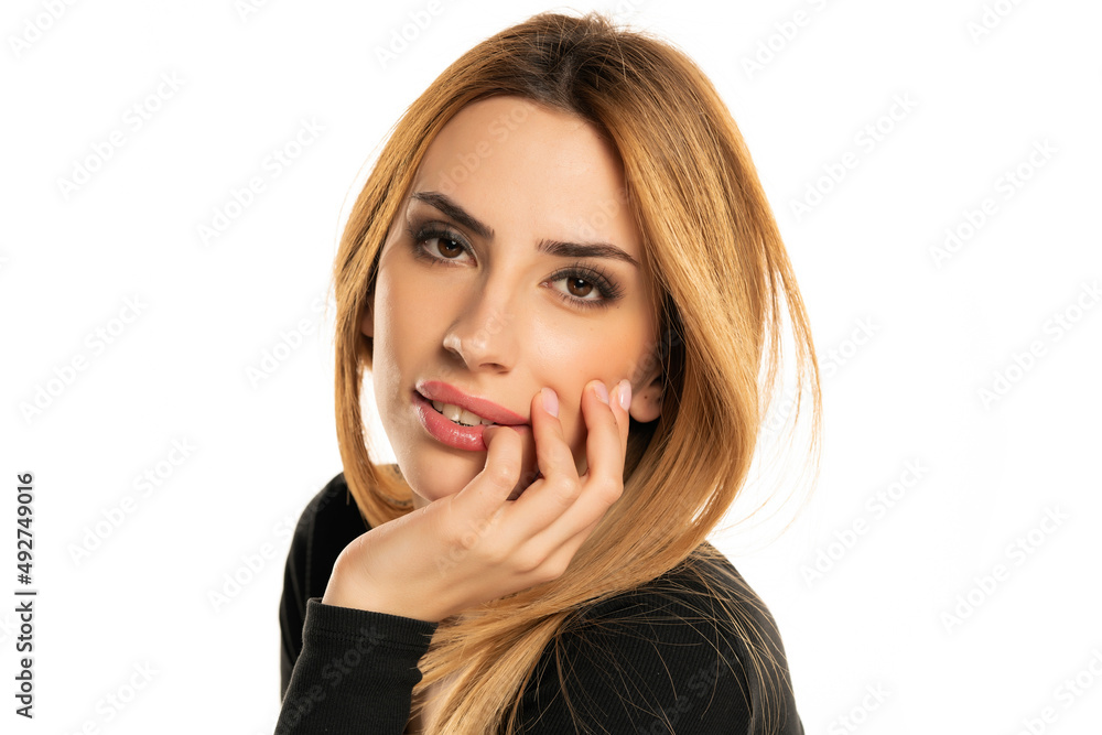 Sensual portrait of a young woman with long straight hair and black blouse Sensual portrait of a young woman with long straight hair and black blouse