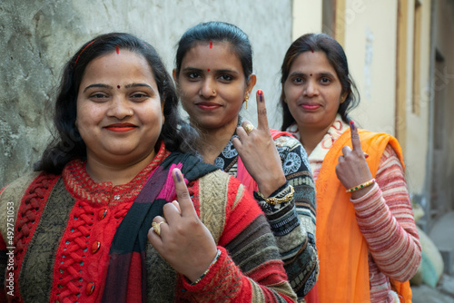 indian woman voters showing voter mark on finger after polling