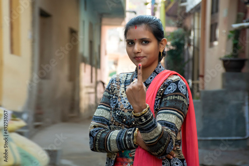 indian woman showing voting mark in hand after polling the Vote