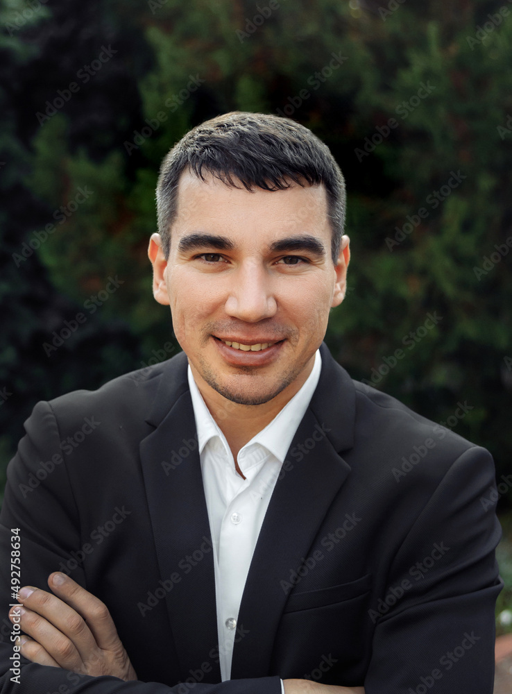 Portrait of a man in a jacket on a green background Portrait of a man in a jacket on a green background