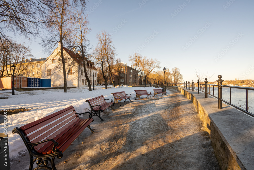 Narva. Estonia. March 10, 2022 . Embankment in the city view of the river and the opposite bank