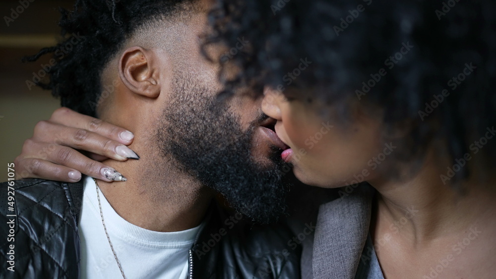 Fototapeta premium Passionate kiss a black couple kissing an African man and woman love