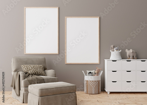 Fototapeta Naklejka Na Ścianę i Meble -  Two empty vertical picture frames on brown wall in modern child room. Mock up interior in scandinavian style. Free, copy space for your picture. Armchair, toys. Cozy room for kids. 3D rendering.