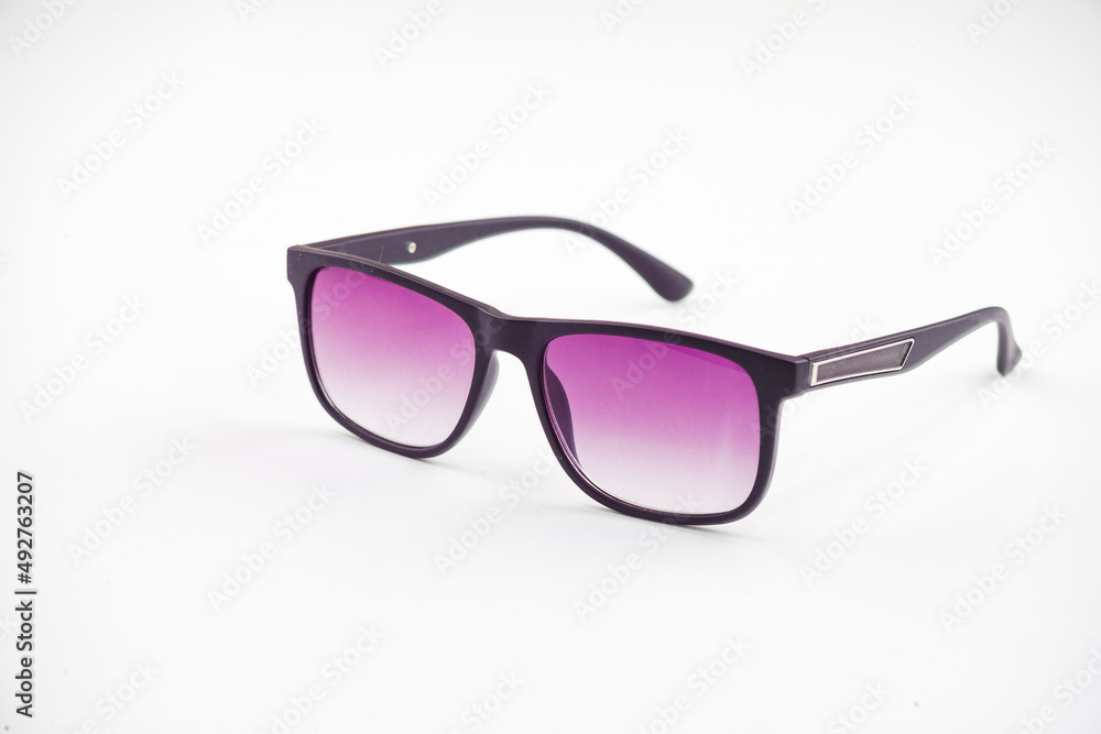 Fashionable sunglasses for women. burgundy glass. beautiful shape. Women's accessory.on a white isolated background. Fashionable sunglasses for women. burgundy glass. beautiful shape. Women's accessory.on a white isolated background.