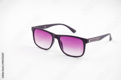 Fashionable sunglasses for women. burgundy glass. beautiful shape. Women's accessory.on a white isolated background.