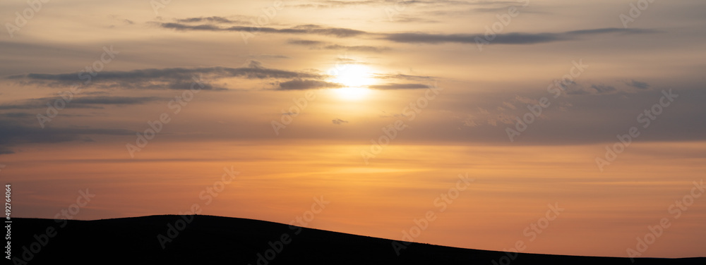 Picturesque sunset, setting sun, panoramic view