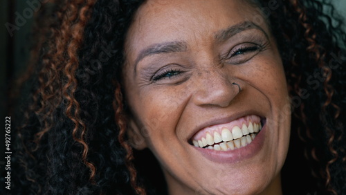 A smiling happy black woman portrait face a Brazilian hispanic person © Marco