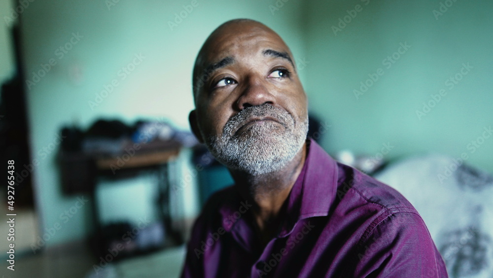 Fototapeta premium A senior man having HOPE and FAITH during hard difficult times