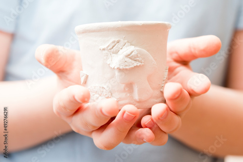 Working with natural clay. Old style pot production lessons for children. Children activities at home, school, extracurricular group. Handmade Pottery Cup Made by kid.