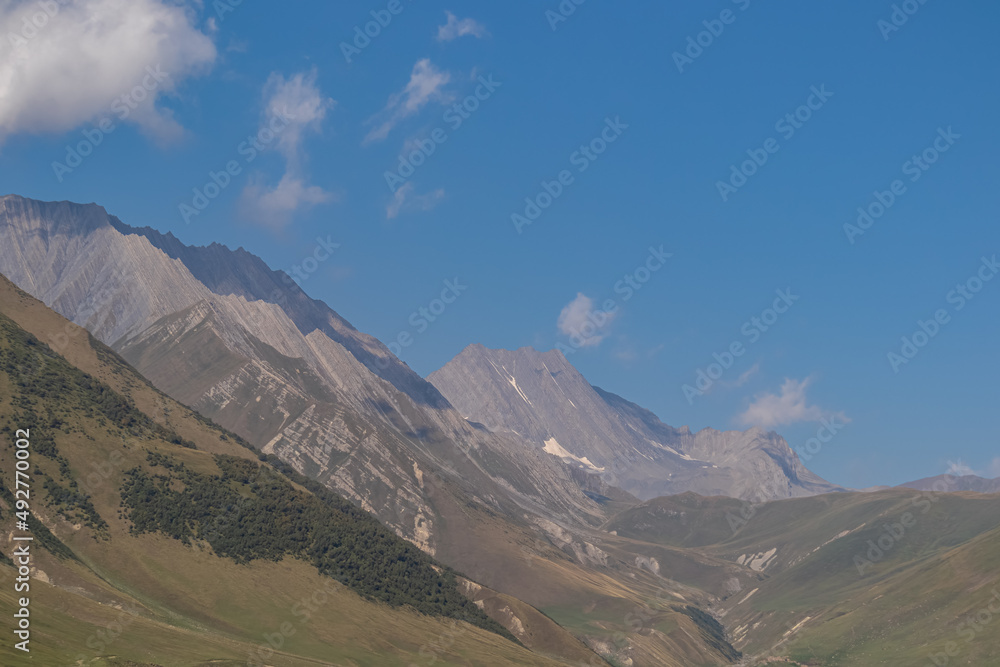 A view on the sharp ridges in Ossetia from the Truso Valley near the Ketrisi Village Kazbegi District, Mtskheta in the Greater Caucasus Mountains, Georgia. Russian Border. Trekking, Wanderlust.