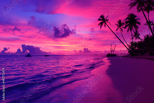 Fototapeta Naklejka Na Ścianę i Meble -  fantasy tropical sunset on the beach. Amazing Colorful sky purple cloud and sky dramatic color background. Majestic Sunlight Cloud fluffy