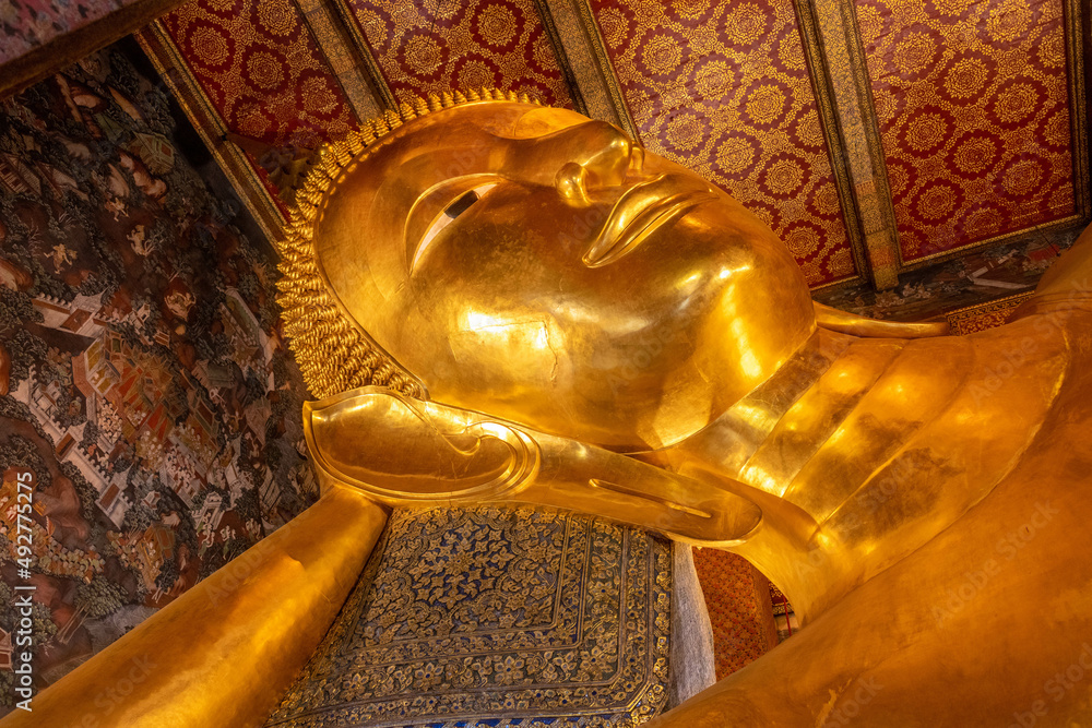 Giant golden reclining Buddha statue at Wat Pho Temple in Bangkok