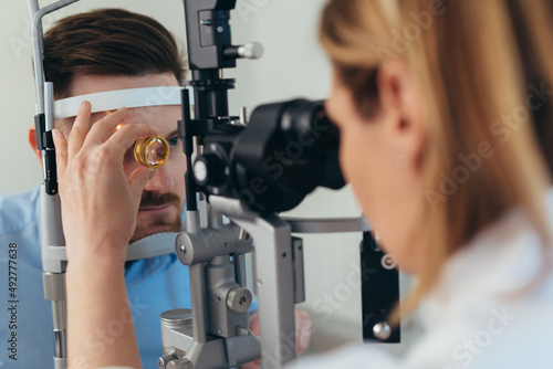 man has eyesight examination at clinic