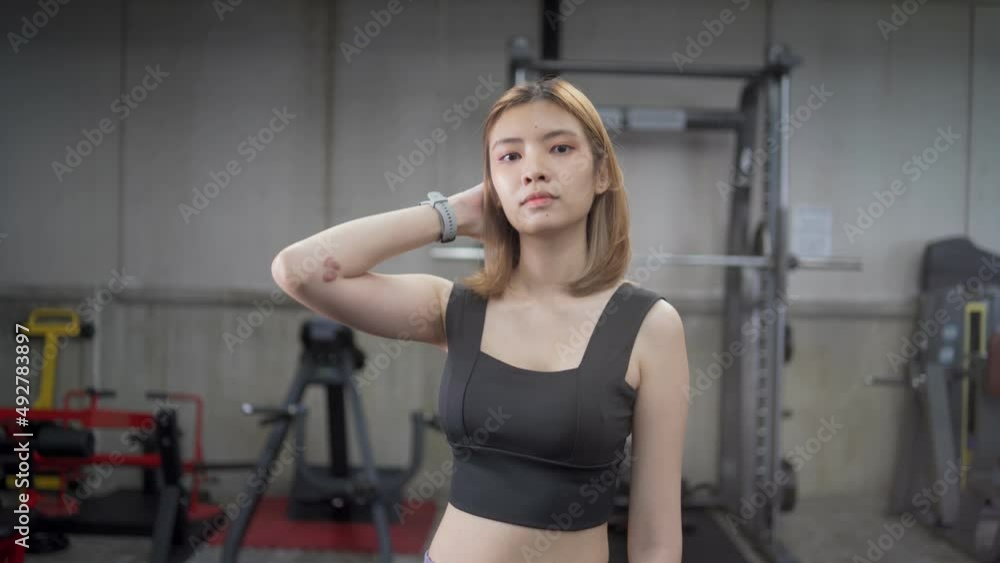 Close up of pretty girl sportswoman looking at cam after physical training. Close up of pretty girl sportswoman looking at cam after physical training.