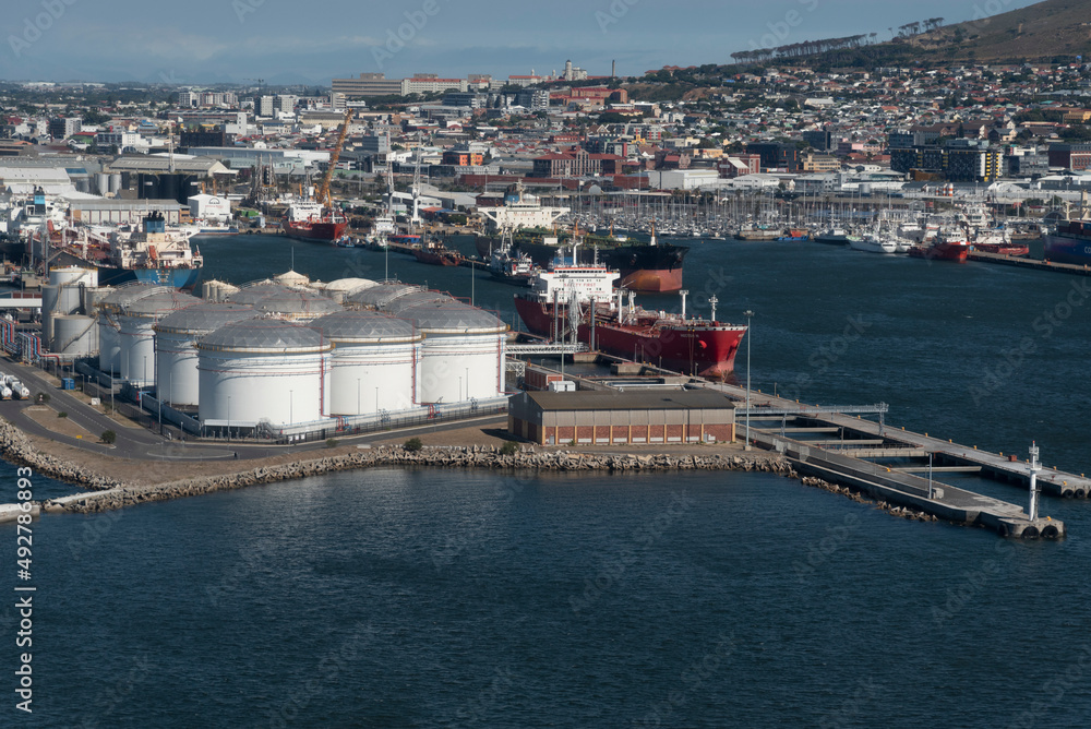 Cape Town, South Africa. 2022. Aerial view of oil storage tanks and tanker ship in the Port of Cape Town.ship in the port.
