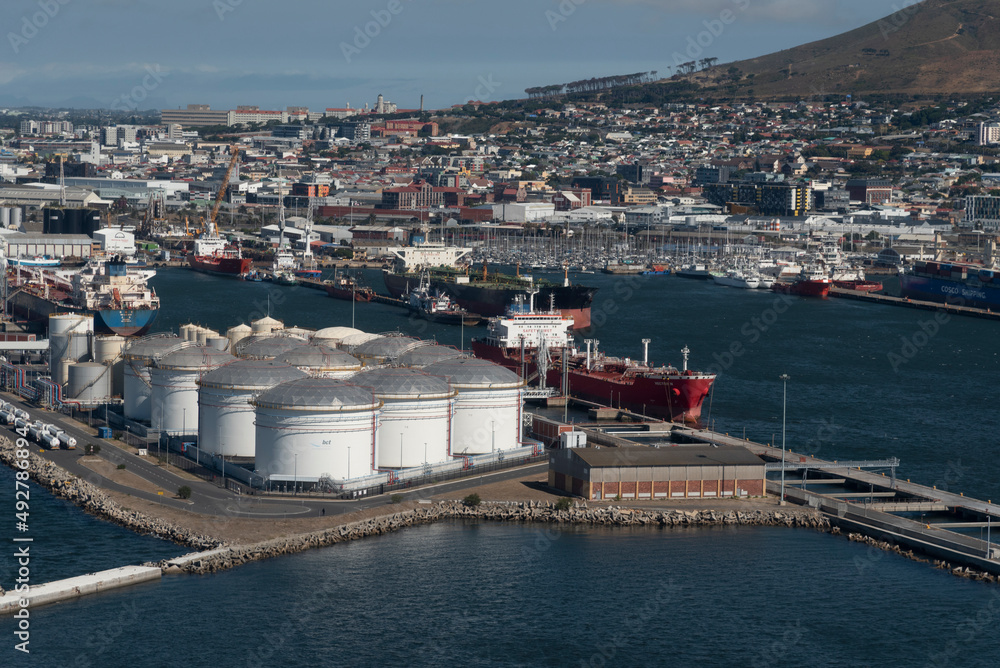 Cape Town, South Africa. 2022. Aerial view of oil storage tanks and tanker ship in the Port of Cape Town.ship in the port.