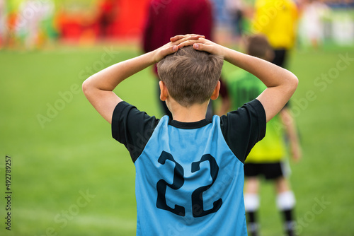 Canvas Print Disappointed Soccer Boy on Football Game