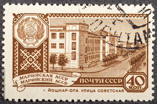 USSR stamp CIRCA 1961: A postage stamp printed in the Soviet Union in 1961. Sovetskaya Street in the capital of Mari El - the city of Yoshkar-Ola. Coat of arms of the Autonomous Mari Republic within photo