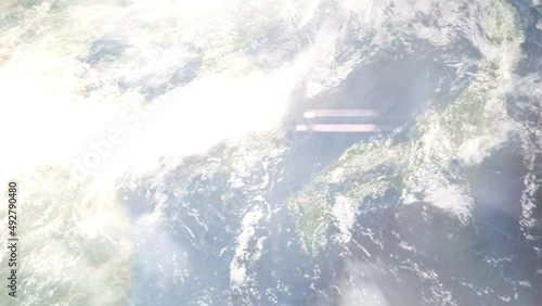 Earth zoom in from outer space to city. Zooming on Gimhae, South Korea. The animation continues by zoom out through clouds and atmosphere into space. Images from NASA photo