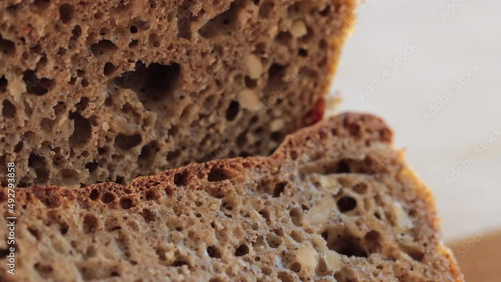 Home made sourdough bread: Fresh, home made bread after baking - macro photo. Some areas in focus. Bread with water, sunflower seeds, goji berries, wheat and hemp flour. Home made sourdough bread: Fresh, home made bread after baking - macro photo. Some areas in focus. Bread with water, sunflower seeds, goji berries, wheat and hemp flour.