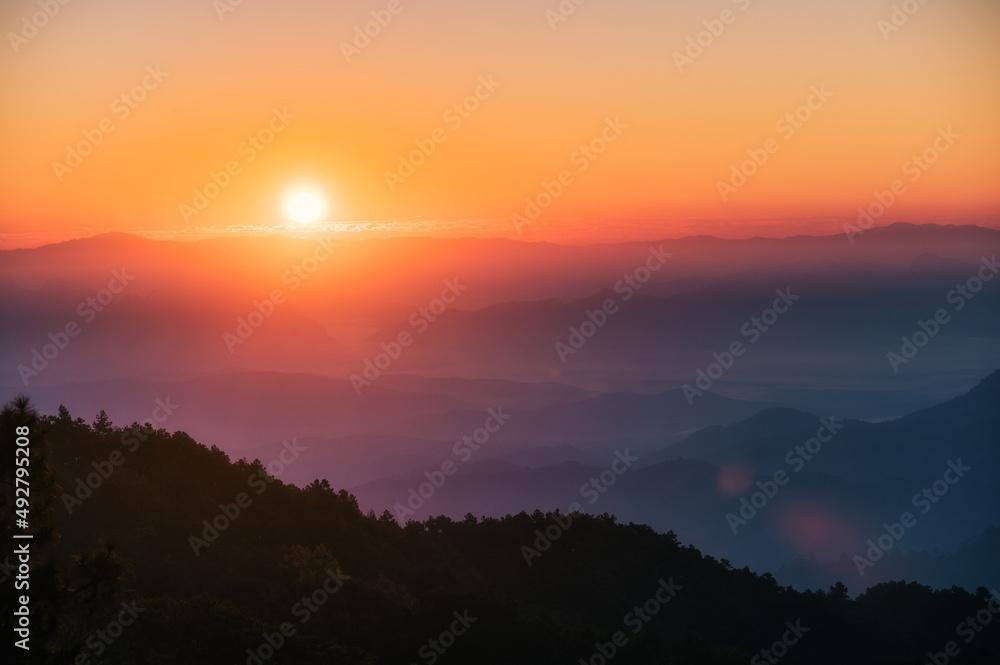 Sunrise over mountain with colorful sky in tropical rainforest at national park in the morning Sunrise over mountain with colorful sky in tropical rainforest at national park in the morning