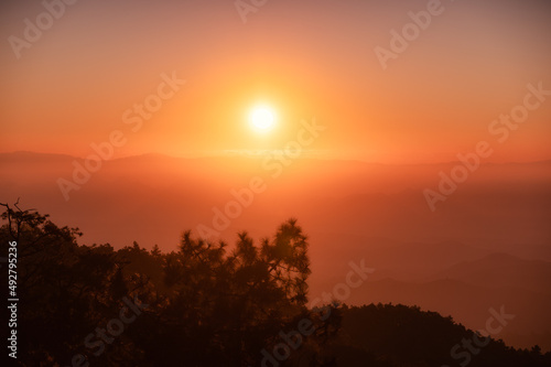 Sunrise over mountain with colorful sky in tropical rainforest at national park in the morning