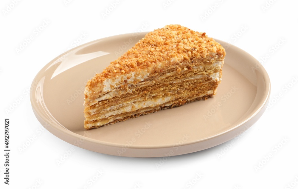 Slice of delicious honey cake isolated on white