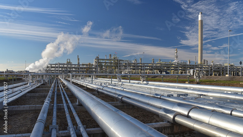 natural gas pipeline - pipes and buildings of a refinery - industrial plant for fuel production