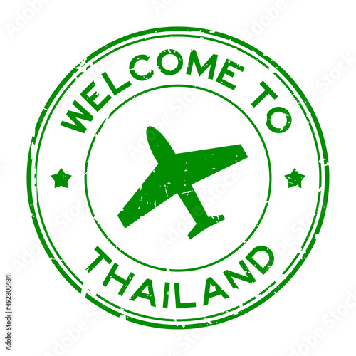 Grunge green welcome to Thailand word with airplane icon round rubber seal stamp on white background