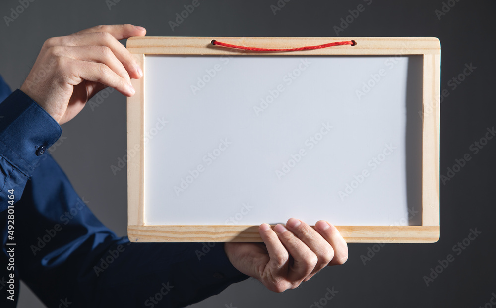 Man showing empty school whiteboard. Man showing empty school whiteboard.