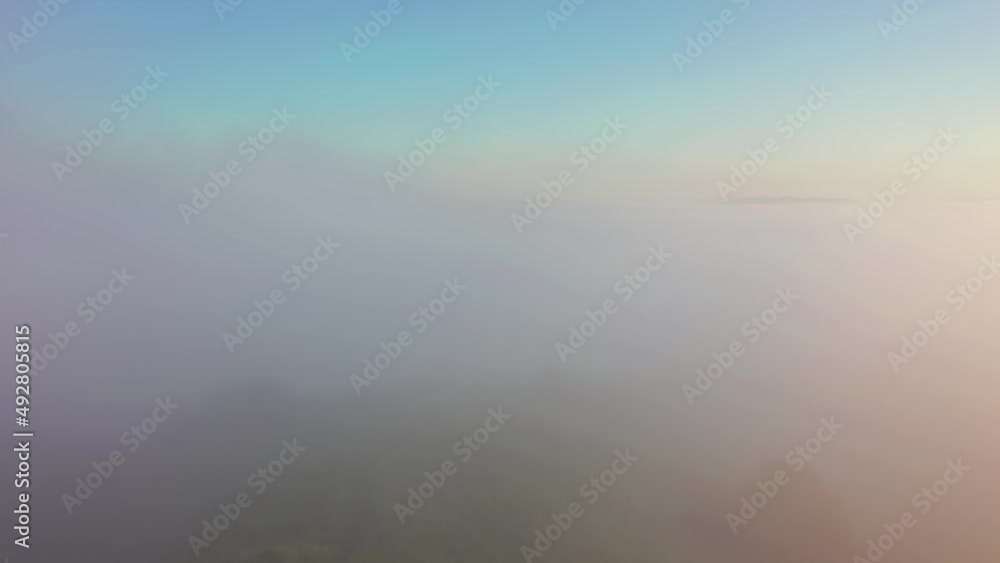 Fantastic view of the countryside covered with fog from a bird's eye view. Filmed UHD 4k video. Fantastic view of the countryside covered with fog from a bird's eye view. Filmed UHD 4k video.