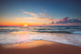 Tropical Beach sunrise over the sea shore and  waves