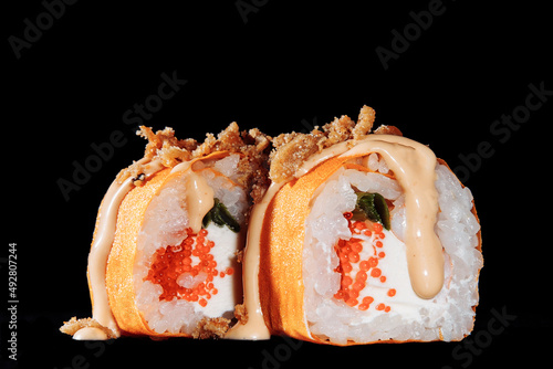 Cold cooked rice dressed with vinegar that is shaped into pieces and topped with raw or cooked fish, or formed into a roll with fish, egg, or vegetables and often wrapped in seaweed.