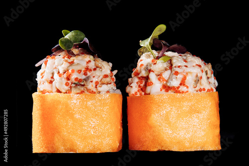 Cold cooked rice dressed with vinegar that is shaped into pieces and topped with raw or cooked fish, or formed into a roll with fish, egg, or vegetables and often wrapped in seaweed.