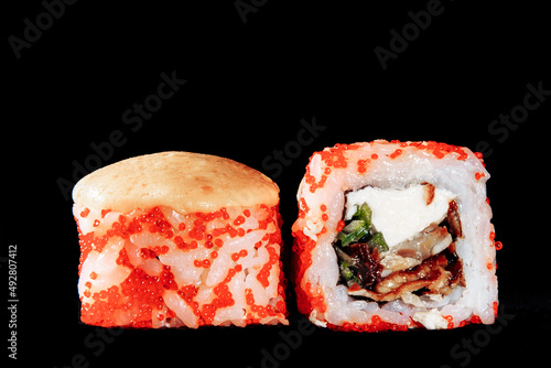 Cold cooked rice dressed with vinegar that is shaped into pieces and topped with raw or cooked fish, or formed into a roll with fish, egg, or vegetables and often wrapped in seaweed.
