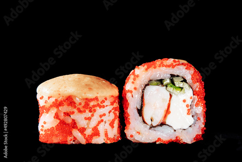 Cold cooked rice dressed with vinegar that is shaped into pieces and topped with raw or cooked fish, or formed into a roll with fish, egg, or vegetables and often wrapped in seaweed.