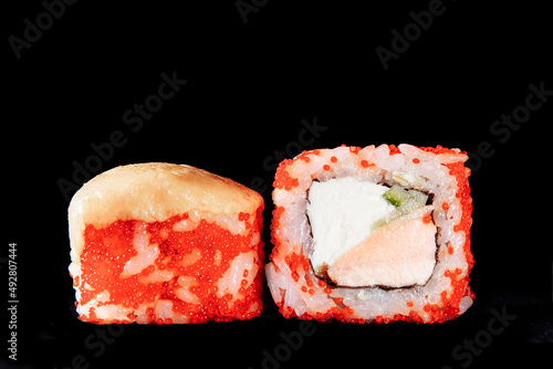 Cold cooked rice dressed with vinegar that is shaped into pieces and topped with raw or cooked fish, or formed into a roll with fish, egg, or vegetables and often wrapped in seaweed.