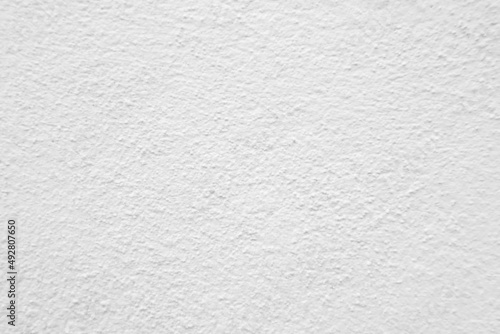 Seamless texture of white cement wall a rough surface, with space for text, for a background.